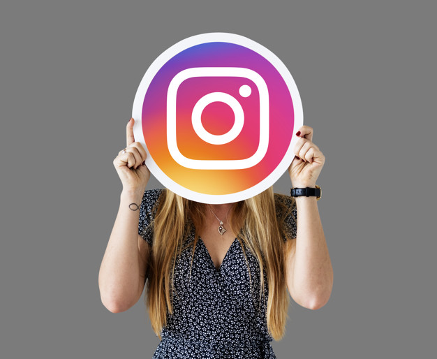 Woman showing an Instagram icon